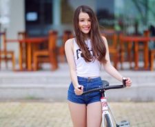 Asian Beautiful Girl Bicycle Outsine Coffee Shop