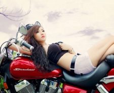 Asian Girl Lying On Bike Seat White Shorts Bra